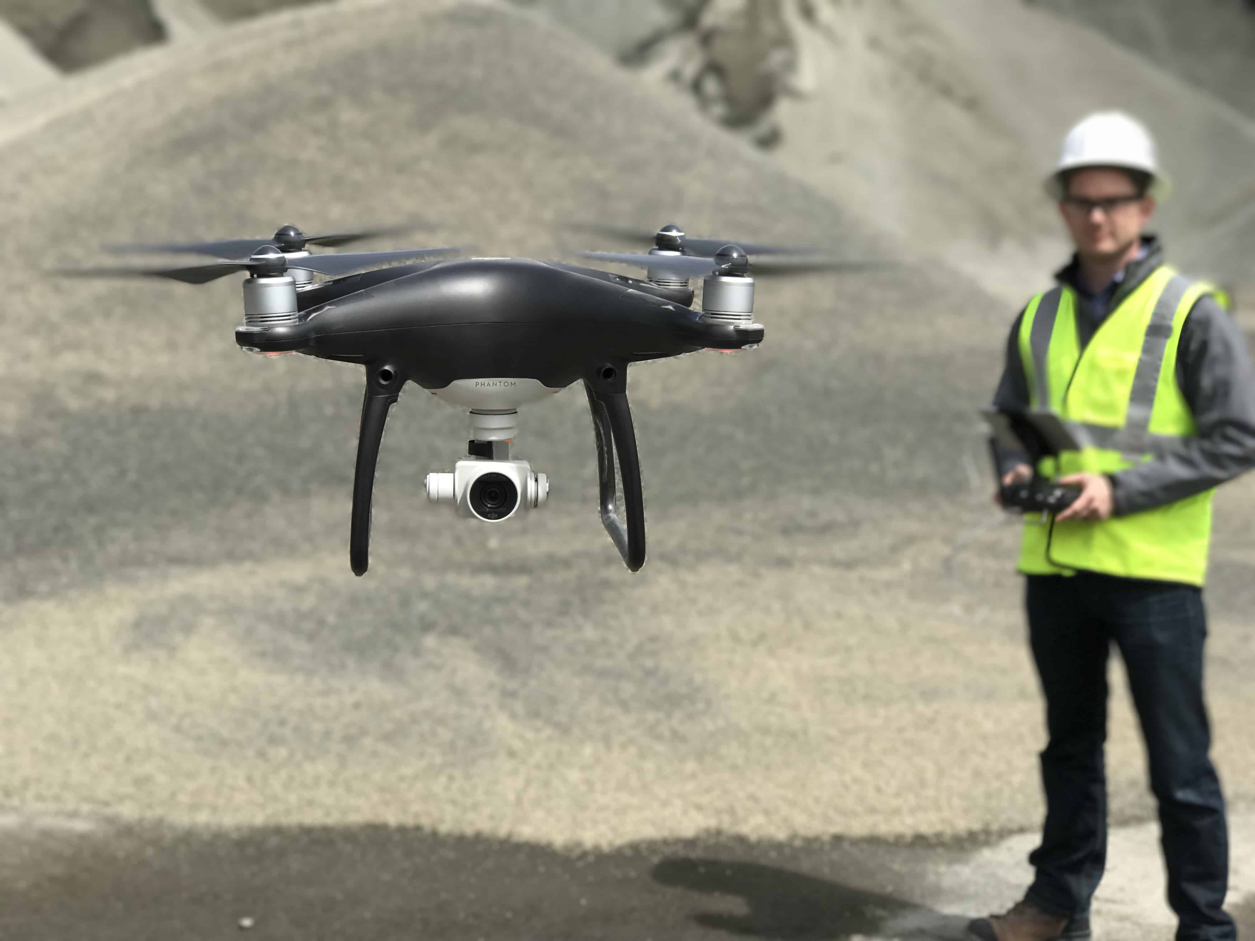 Pilot flying a drone with Stockpile Reports